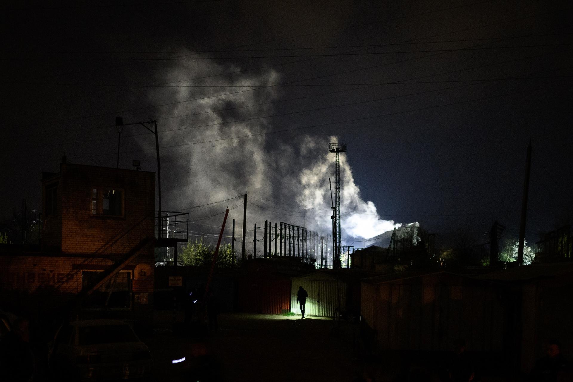 May 3, 2022 - Police search an area hit by an attack in Lviv, western Ukraine amid smoke and fire - May 3, 2022 - Leon Neal/Getty Images