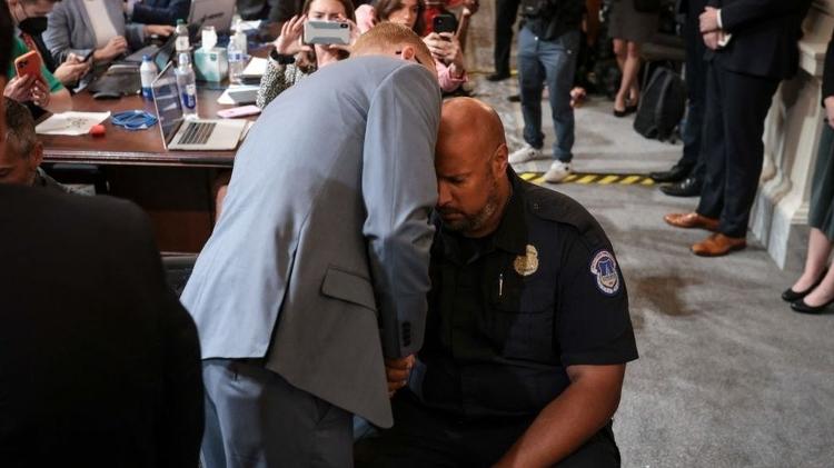 Stephen Ayres shakes hands with Capitol Police officer Harry Dunn after testifying - Getty Images - Getty Images