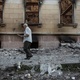A man walks next to a building damaged by a military attack in Lysychansk, Ukraine - Oleksandr Ratushniak/Reuters