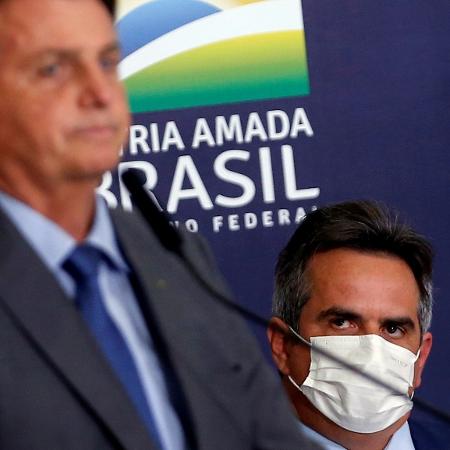 Bolsonaro é observado por Ciro Nogueira em evento no Planalto - Adriano Machado/Reuters - 27.jul.2021