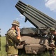 Ukrainian artillery prepares to fire BM-21 Grad multiple rocket launchers near Izyum, south of Kharkiv, amid the war with Russia.