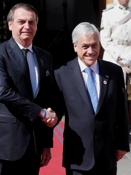 Jair Bolsonaro durante encontro com o presidente do Chile, Sebastian Piñera - Rodrigo Garrido/Reuters
