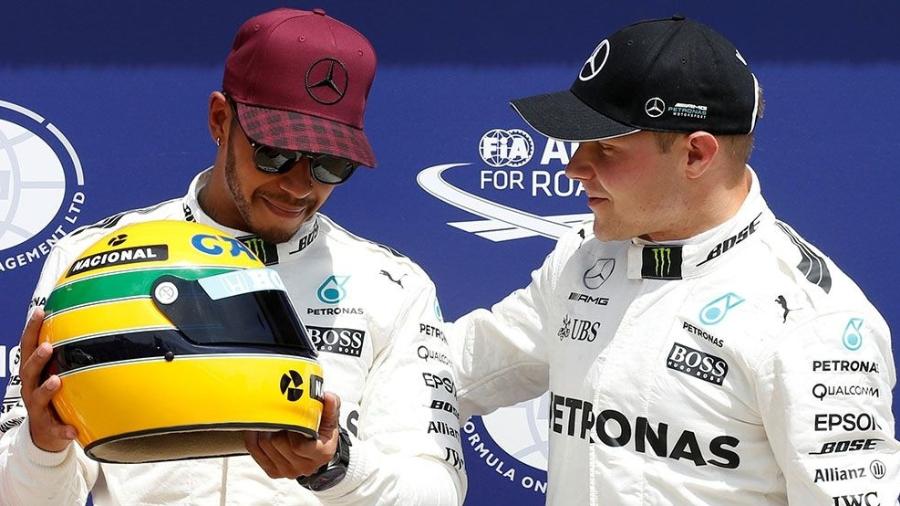 Hamilton recebeu o capacete de Senna pela marca - Chris Wattie/Reuters