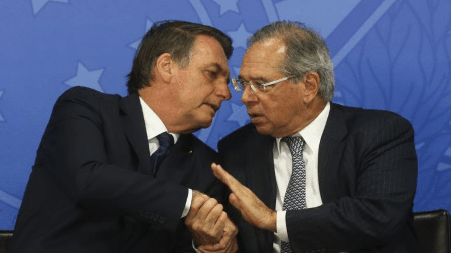 Paulo Guedes ao lado do presidente Jair Bolsonaro - Antônio Cruz/Agência Brasil