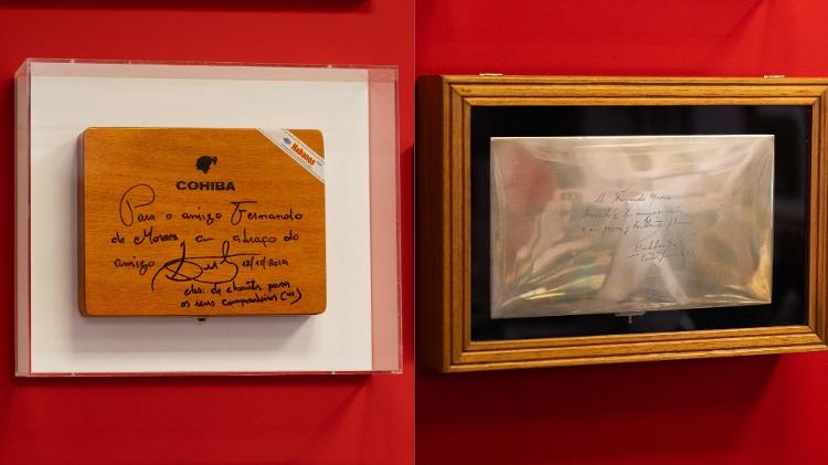 Na parede do escritório, uma caixa de charutos cubanos, presente de Lula (à esq.) e um bilhete do líder cubano Fidel Castro a Morais, em 1977: desejo de "maiores êxitos" ao "jovem e brilhante" escritor